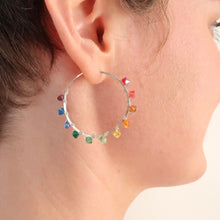 Load image into Gallery viewer, Rainbow Hoop Earrings. Sterling Silver 1.25 inch Swarovski Crystal Rainbow Hoops. Hand Hammered Shiny Large Sterling Silver Hoops