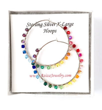 Load image into Gallery viewer, Rainbow Hoop Earrings. 2.5 inch Sterling Silver Swarovski Crystal Rainbow Hoops. Hand Hammered Shiny Large Sterling Silver Hoops

