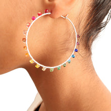 Load image into Gallery viewer, Rainbow Hoop Earrings. 2.5 inch Sterling Silver Swarovski Crystal Rainbow Hoops. Hand Hammered Shiny Large Sterling Silver Hoops

