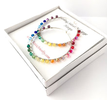 Load image into Gallery viewer, Rainbow Hoop Earrings. 2.5 inch Sterling Silver Swarovski Crystal Rainbow Hoops. Hand Hammered Shiny Large Sterling Silver Hoops

