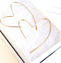 Load image into Gallery viewer, Gold Heart Earrings. 14k gold heart hoop earrings. 14k Solid Gold Hammered Heart Earrings. Yellow Gold Hoop Earrings. 1.75 inches long
