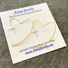 Load image into Gallery viewer, Gold Heart Earrings. 14k gold heart hoop earrings. 14k Solid Gold Hammered Heart Earrings. Yellow Gold Hoop Earrings. 1.75 inches long
