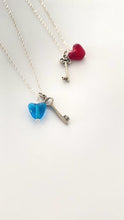 Load and play video in Gallery viewer, Heart Key Necklace. Glass Heart Bead and Skeleton Key Charm Sterling Silver necklace
